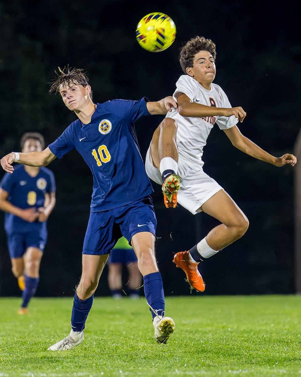 Hartland's Evan Ringle (10) and Brighton's Cayden Tadros (8) battle for the ball during the Bulldogs' 3-0 victory Monday, Aug. 28, 2023.