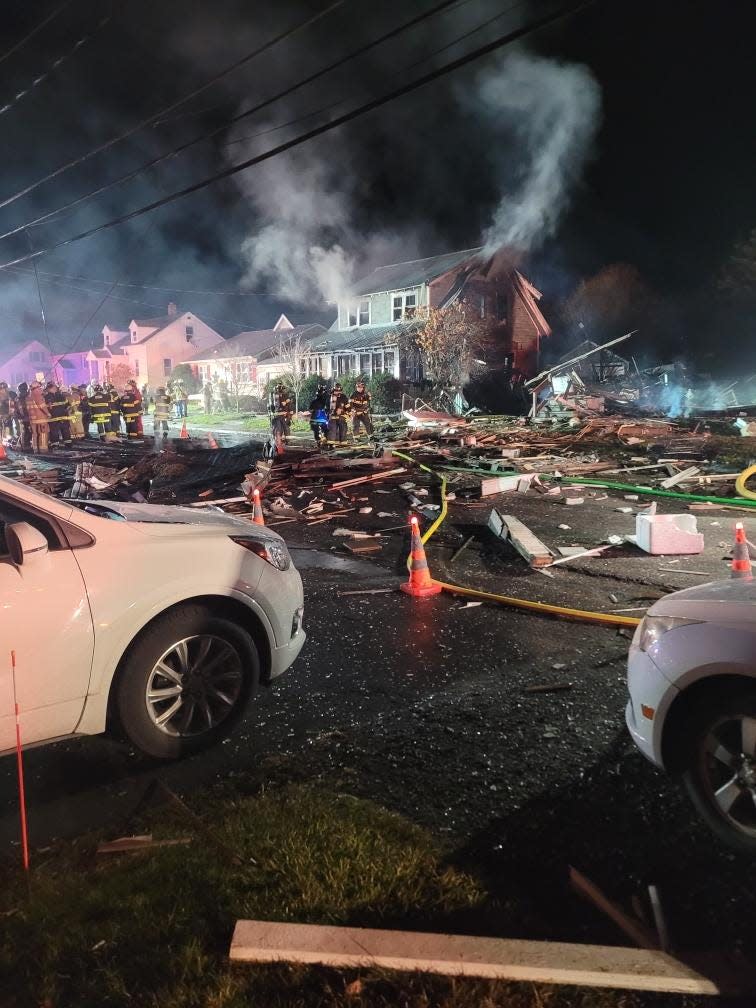 Police investigate an explosion at a house in Oneonta, New York.