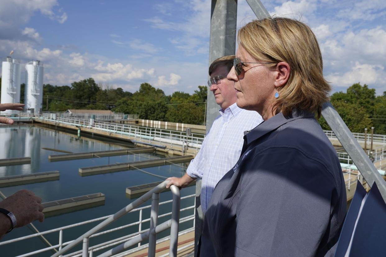Deanne Criswell, administrator of the Federal Emergency Management Agency (FEMA), left, and Mississippi Gov. Tate Reeves look over the sedimentation basins during a visit to the City of Jackson's O.B. Curtis Water Treatment Facility in Ridgeland, Miss., Friday, Sept. 2, 2022. 