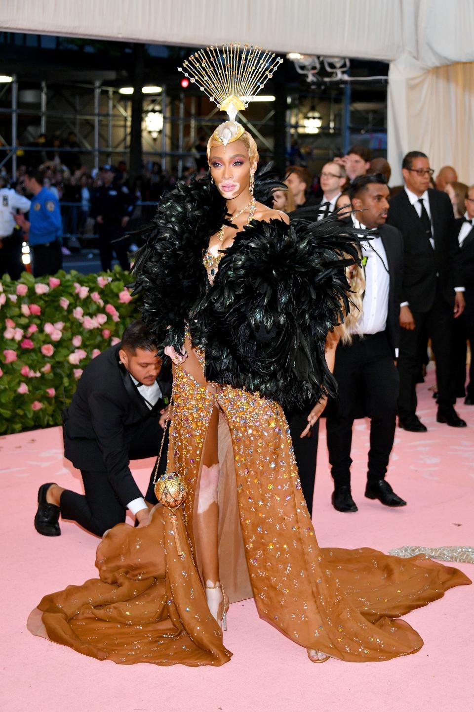 <h1 class="title">Winnie Harlow in Tommy Hilfiger and René Caovilla shoes with a Judith Leiber Couture bag</h1><cite class="credit">Photo: Getty Images</cite>