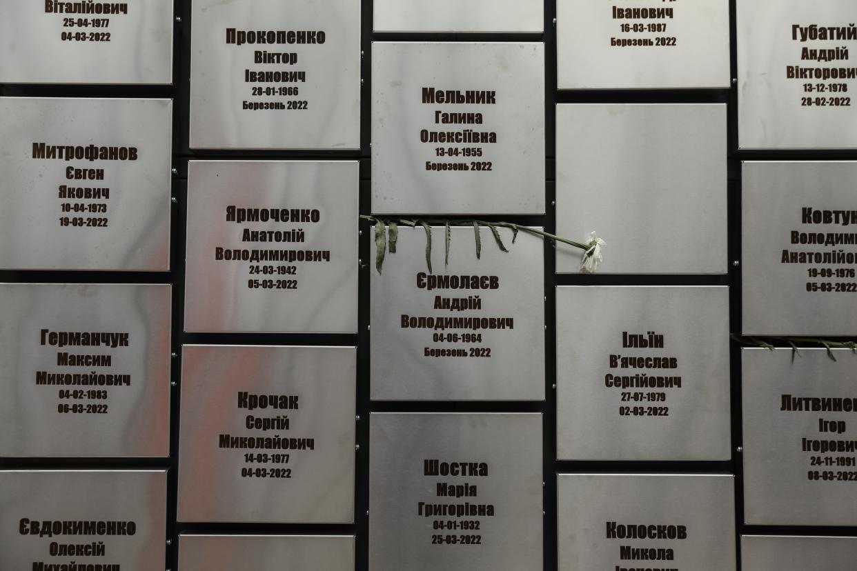 A flower in a memorial for victims of executions and attacks on individual civilians by Russian troops (EPA)