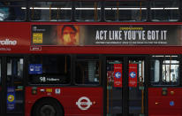 A lone bus passenger sits on the top deck, wearing a mask to prevent the spread of COVID-19, in Oxford Street London, Tuesday, Jan. 26, 2021. The U.K. will soon become the fifth country in the world to record 100,000 COVID-19 deaths, after the United States, Brazil, India and Mexico — all of which have much larger populations than Britain's 67 million people. As of Monday, the U.K.'s official coronavirus death toll was 98,531. (AP Photo/Alastair Grant)