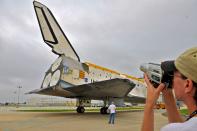 Space Shuttle Discovery leaves the Vehicle Assembly Building (VAB) on its way to the Orbiter Processing Facility at Kennedy Space Center August 11, 2011 in Cape Canaveral, Florida. Space Shuttles Endeavour and Discovery switched buildings as they are being decommissioned with the end of the Shuttle program. (Photo by Roberto Gonzalez/Getty Images)