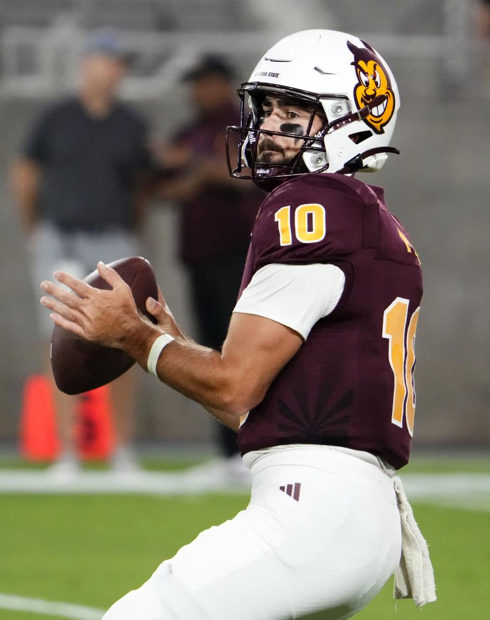 Arizona State Sun Devils quarterback Drew Pyne (10) warms up before playing against the Fresno State Bulldogs at Mountain America Stadium in Tempe on September 16, 2023.