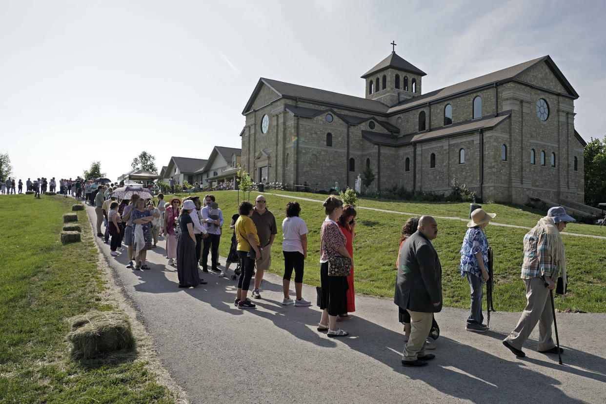 People wait to view the body of Sister Wilhelmina Lancaster at the Benedictines of Mary, Queen of Apostles abbey near Gower, Mo. (AP Photo/Charlie Riedel)