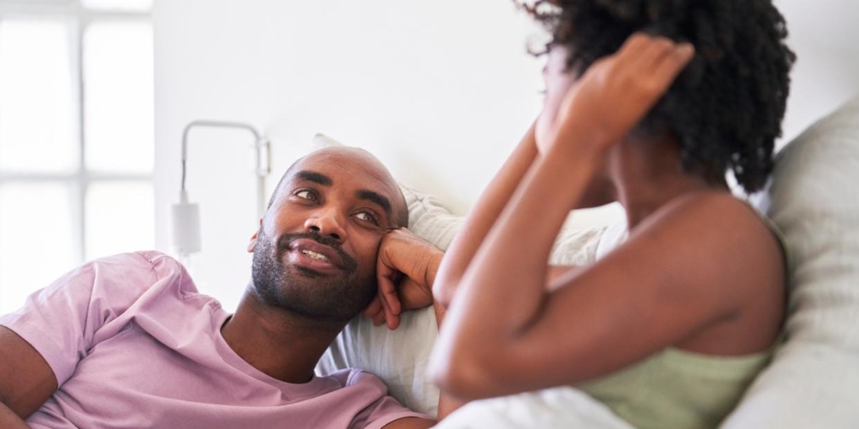 Black couple talking in bed questions to ask your partner communication