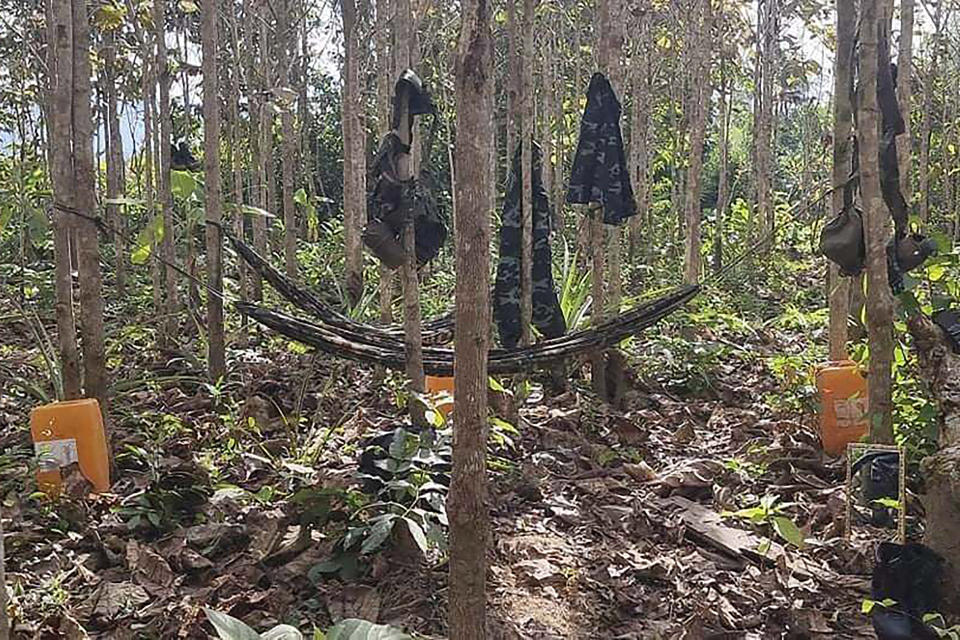 Hammocks are strung between trees, along with military fatigues at a People's Defense Forces camp in the jungles of Kayin State, Myanmar in December 2021. Since Myanmar's military dismissed the results of democratic elections and seized power on Feb. 1, 2021, peaceful nationwide protests and violent crackdowns by security forces have spiraled into a nationwide humanitarian crisis. (AP Photo)