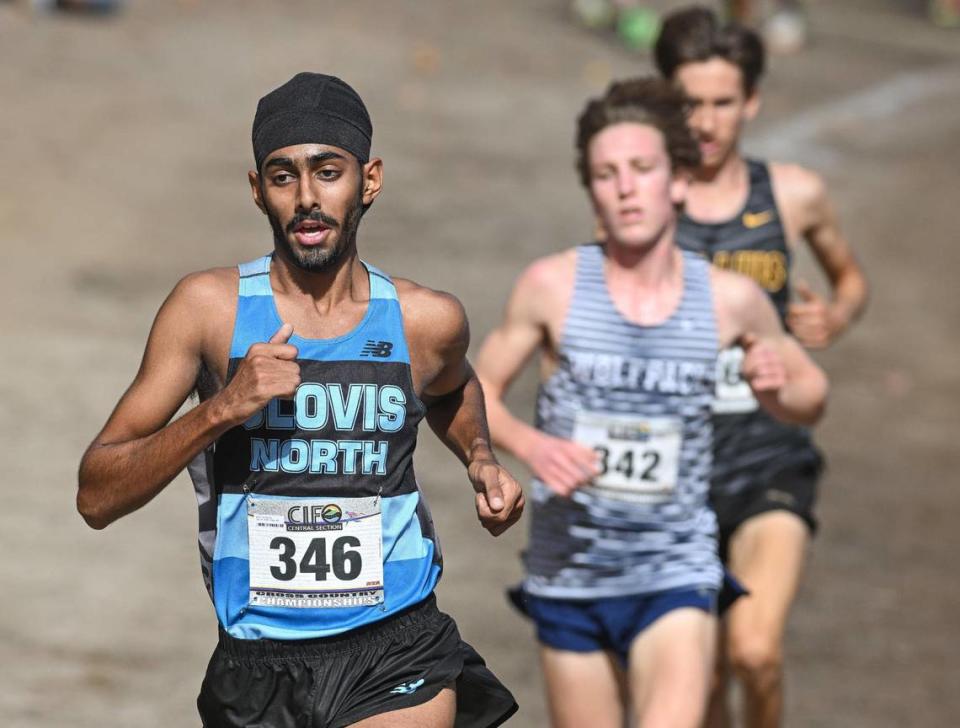 Teg Pandher of Clovis North is out front after the second mile in the Central Section boys Division 1 championship cross country race at Woodward Park on Thursday, Nov. 16, 2023. Pandher finished second to Clovis East’s Carter Spradling.