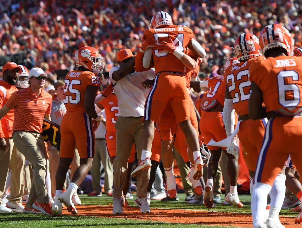 Clemson linebacker Jeremiah Trotter Jr. (54) celebrates intercepting a South Carolina quarterback Spencer Rattler (7) pass and running it in for a touchdown during the first quarter at Memorial Stadium in Clemson, South Carolina Saturday, Nov. 26, 2022.   