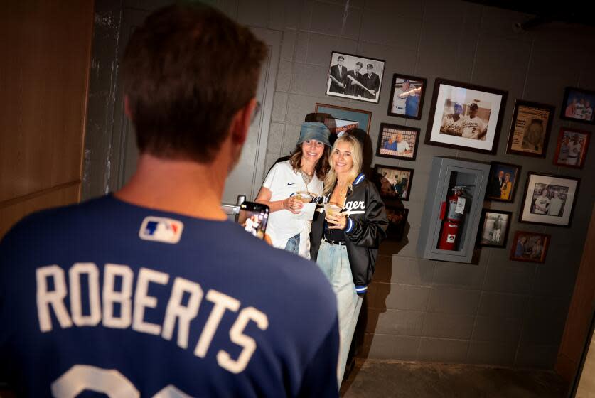 Dodger fans enjoy themselves at the Speakeasy under the right field pavilion at Dodgers Stadium.