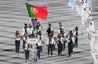 <p>Portugal's delegation parade during the opening ceremony of the Tokyo 2020 Olympic Games, at the Olympic Stadium, in Tokyo, on July 23, 2021. (Photo by Martin BUREAU / AFP) (Photo by MARTIN BUREAU/AFP via Getty Images)</p> 