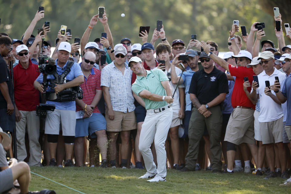 Rory McIlroy chips to the sixteenth green during the final round of the Tour Championship golf tournament at East Lake Golf Club Sunday, Aug. 28, 2022, in Atlanta. (Jason Getz/Atlanta Journal-Constitution via AP)