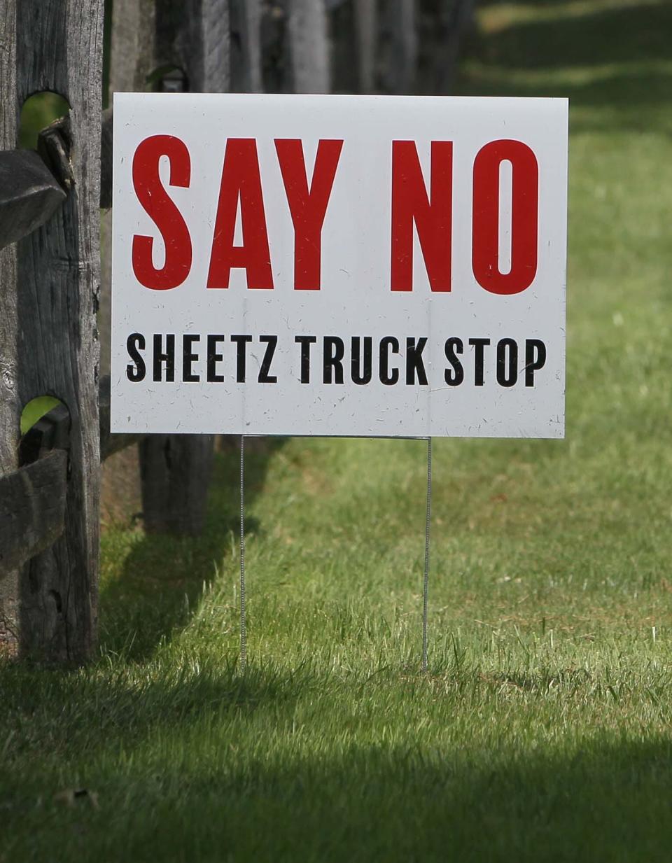 Many residents along Olde Eight Road in Boston Heights post signs in their yards opposing plans for a Sheetz gas station in the village.