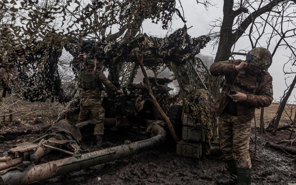 Ukrainian soldiers fire L119 artillery at their fighting position in the direction of Bakhmut