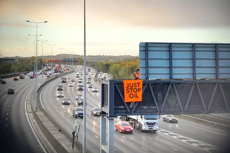 Just Stop Oil protesters scaled overhead gantries along the M25(Just Stop Oil/PA) (PA Media)