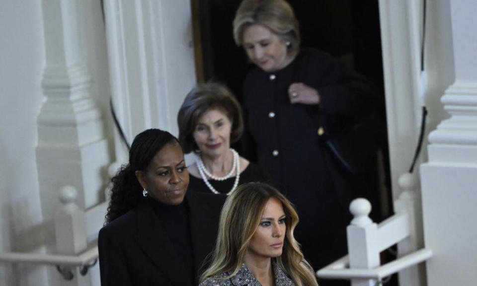 Hillary Clinton, Laura Bush, Michelle Obama and Melania Trump arrive at the tribute.