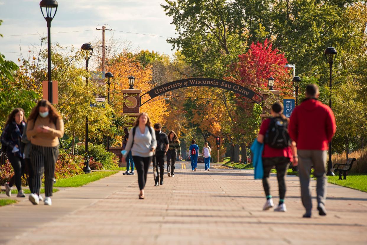Students walk on UW-Eau Claire's campus in fall.