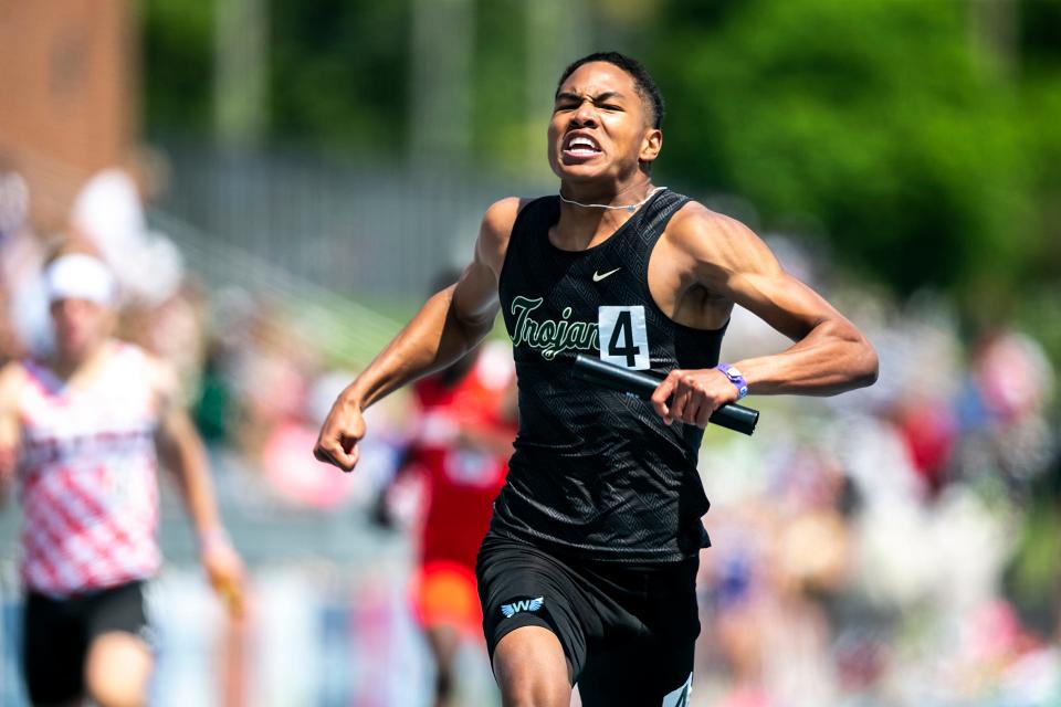 Iowa City West's Izaiah Loveless reacts after anchoring their win in the Class 4A boys 4x200 meter relay during the high school state track and field championships on Friday. The Trojans won two relay titles Friday.