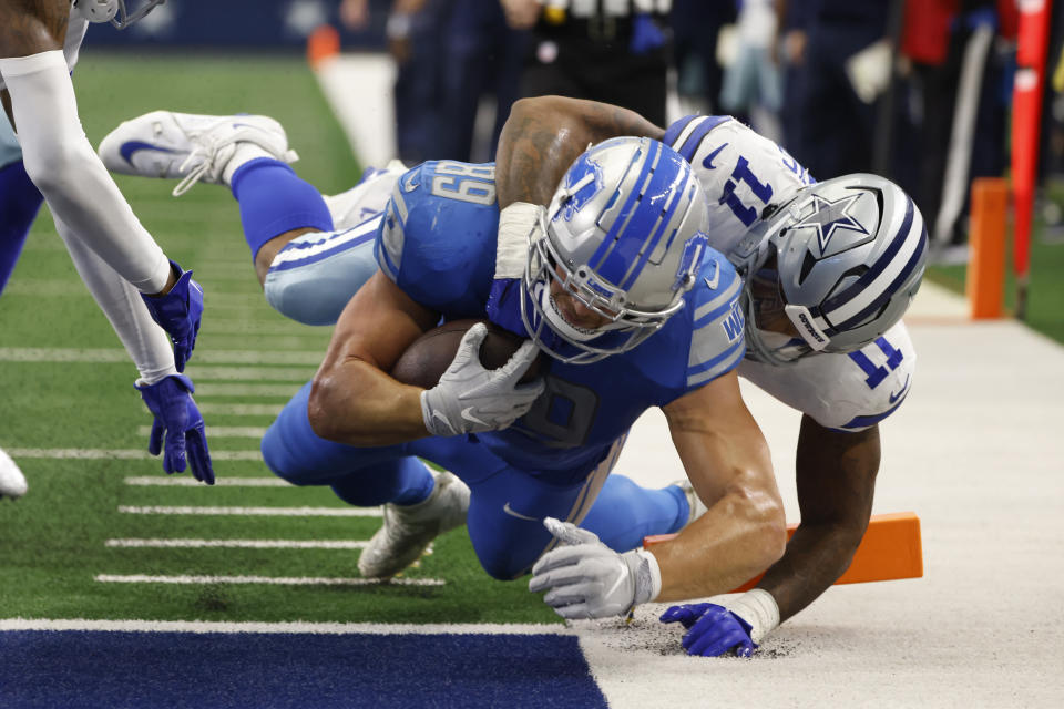 Detroit Lions tight end Brock Wright (89) is tackled at the 1-yard line by Dallas Cowboys linebacker Micah Parsons (11) during the second half of an NFL football game, Sunday, Oct. 23, 2022, in Arlington, Texas. (AP Photo/Ron Jenkins)