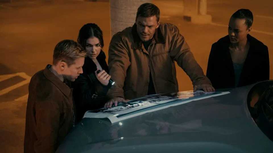 Shaun Sipos, Serinda Swan, Alan Ritchson and Maria Sten investigate a murder in Amazon's "Reacher." - Brooke Palmer/Prime Video