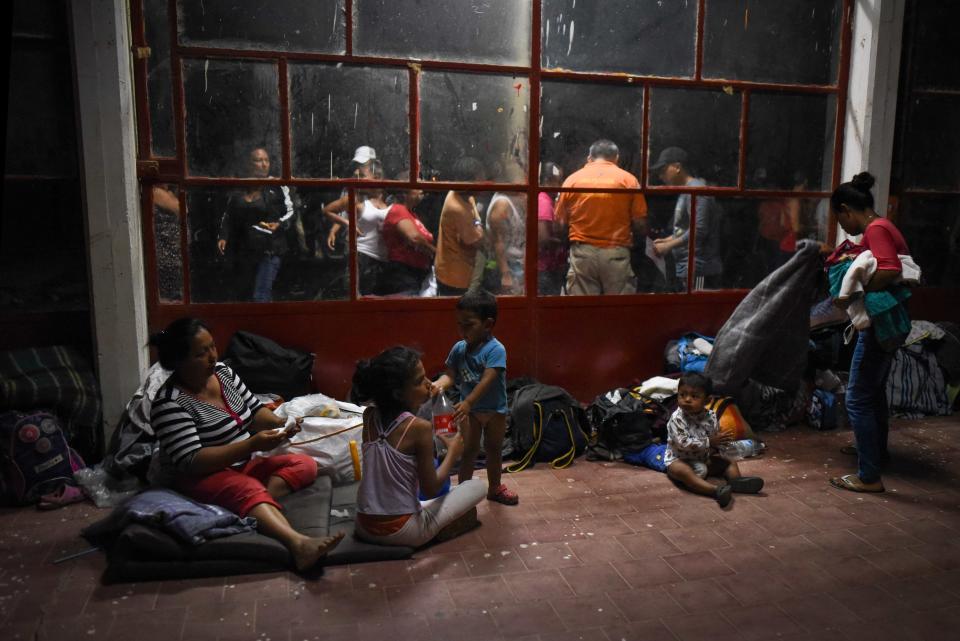 Central American migrants rest at a sports center field in Matias Romero, Mexico, on April 2. (Photo: Victoria Razo/AFP/Getty Images)