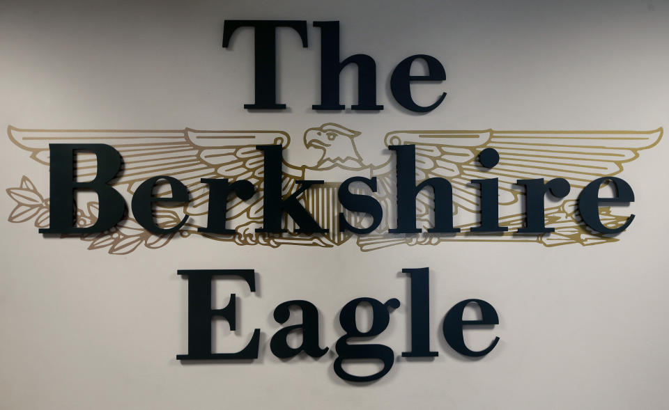 In this Tuesday, April 9, 2019 photo a The Berkshire Eagle emblem is attached to a wall inside the newspaper, in Pittsfield, Mass. The paper now features a new 12-page lifestyle section for Sunday editions, a reconstituted editorial board, a new monthly magazine, and the newspaper print edition is wider. That level of expansion is stunning in an era where U.S. newspaper newsroom employment has shrunk by nearly half over the past 15 years. (AP Photo/Steven Senne)