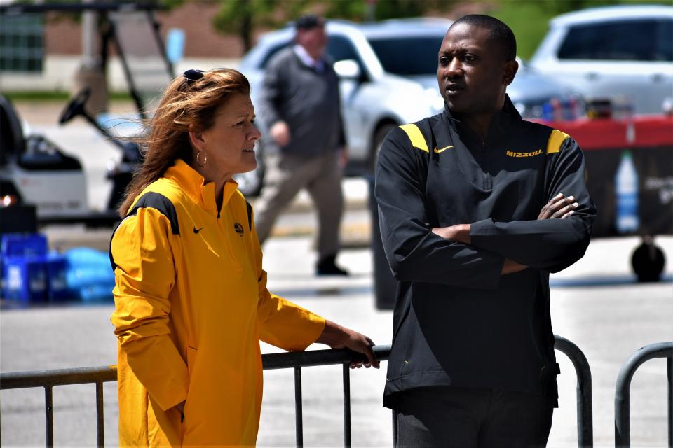 Missouri head men's basketball coach Dennis Gates, right, and head women's basketball coach Robin Pingeton chat during Missouri athletics' Come Home Tour stop Sunday outside the Hearnes Center.