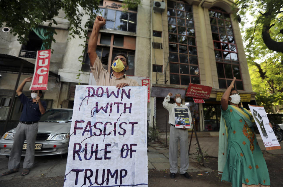 Activists of Socialist Unity Centre of India shout slogans in Ahmedabad, India, Tuesday, June 2, 2020 in solidarity with protests against the recent killing of George Floyd, a black man who died in police custody in Minneapolis, U.S.A., after being restrained by police officers on Memorial Day. (AP Photo/Ajit Solanki)