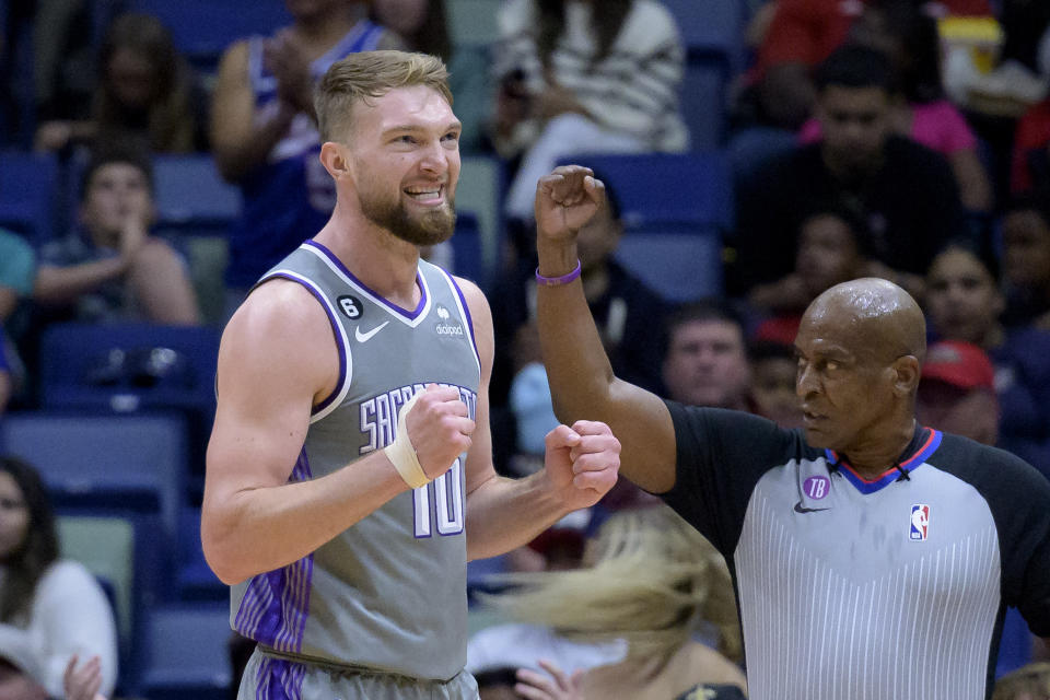 Sacramento Kings forward Domantas Sabonis (10) celebrates a basket and free throw against the New Orleans Pelicans during the first half of an NBA basketball game in New Orleans, Tuesday, April 4, 2023. (AP Photo/Matthew Hinton)