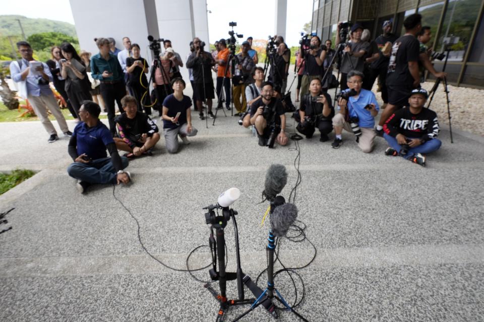 Journalists wait for WikiLeaks founder Julian Assange in Saipan, Mariana Islands, Wednesday, June 26, 2024. (AP Photo/Eugene Hoshiko)