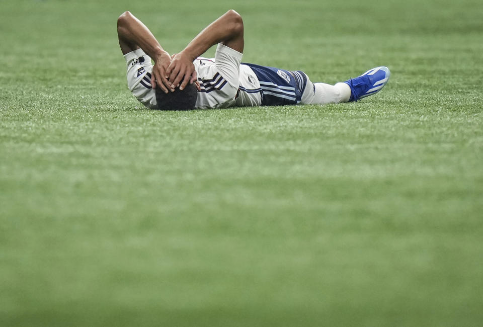 Vancouver Whitecaps' Pedro Vite lies on the field after Los Angeles FC defeated his team in Game 2 of a first-round MLS playoff soccer match in Vancouver, British Columbia, Sunday, Nov. 5, 2023. (Darryl Dyck/The Canadian Press via AP)