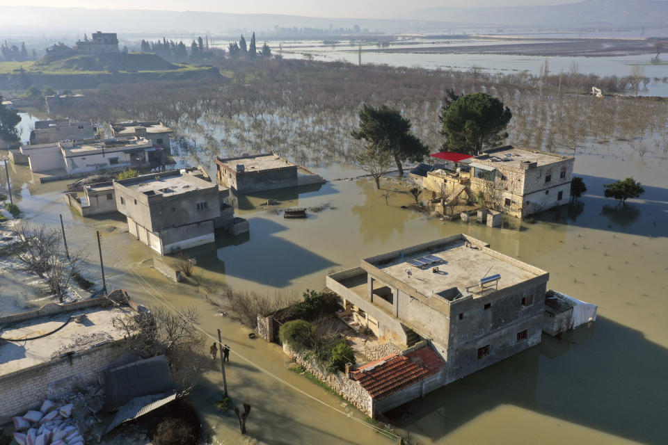 An aerial view of the al-Tlul village flooded after a devastating earthquake destroyed a river dam in the town of Salqeen near the Turkish border, Idlib province, Syria, Thursday, Feb. 9, 2023. (AP Photo/Ghaith Alsayed)