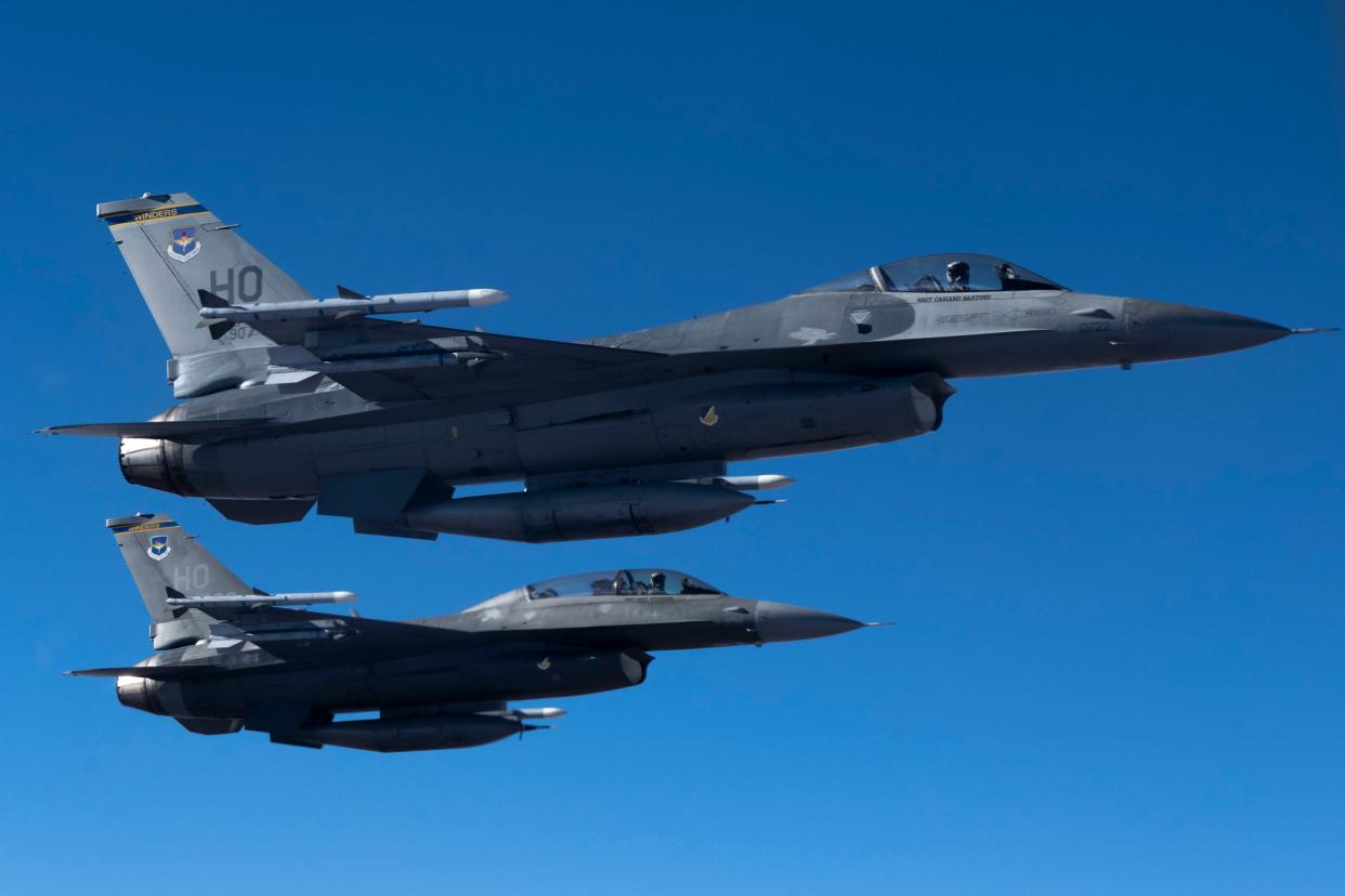 Two F-16 Vipers from the 314th Fighter Squadron at Holloman Air Force Base, New Mexico, fly next to a KC-135 Stratotanker from the 121st Air Refueling Wing at Rickenbacker Air National Guard Base, Columbus, Ohio, over New Mexico on Nov. 15, 2022.