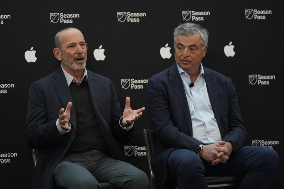 Major League Soccer commissioner Don Garber, left, speaks next to Apple senior vice president of Services Eddy Cue during MLS soccer media day in San Jose, Calif., Tuesday, Jan. 10, 2023. (AP Photo/Jeff Chiu)