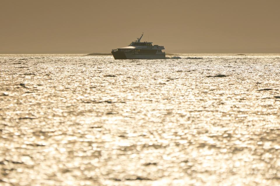 The Seastreak high speed ferry races across Buzzards Bay during an early morning return to New Bedford harbor.