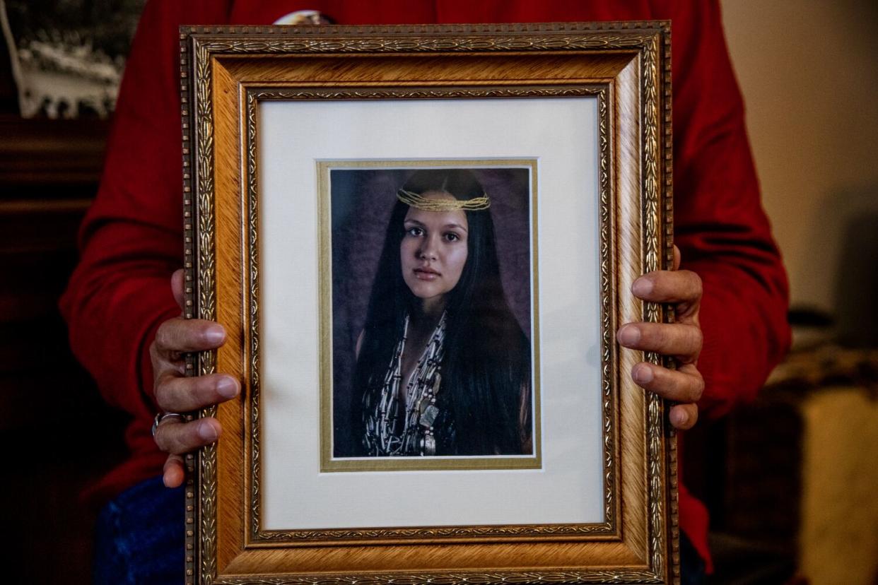 Judy Risling holds a photograph of her daughter Emmilee Risling