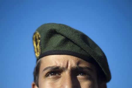 A member of Iran's Revolutionary guard stands at attention during an anti-U.S. ceremony in Azadi (freedom) Square in Tehran April 25, 2010. REUTERS/Morteza Nikoubazl/Files