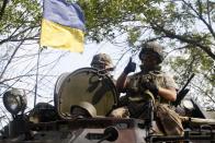 Ukrainian soldiers patrol in Donetsk region on September 3, 2014