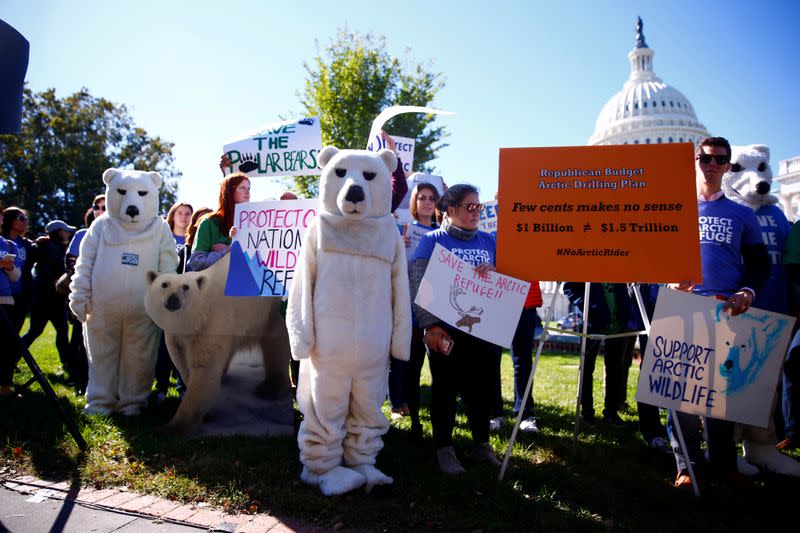 FILE PHOTO: Activists attend a protest against the legislation that would open Wilderness in Alaska to oil drilling on Capitol Hill in Washington
