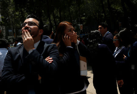 People react after an earthquake hit Mexico City, Mexico September 19, 2017. REUTERS/Carlos Jasso
