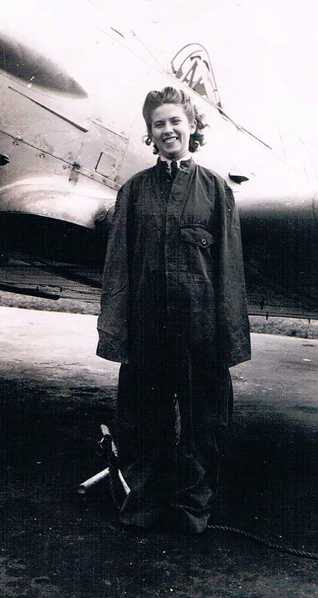 <p class="MsoNormal"><span>Julia Boyd wearing an oversized flightsuit in front of a Harvard training aircraft. Photo courtesy of </span><a href="http://www.thememoryproject.com/stories/2314:julia-boyd/" rel="nofollow noopener" target="_blank" data-ylk="slk:Historica-Dominion Institute;elm:context_link;itc:0;sec:content-canvas" class="link ">Historica-Dominion Institute</a>. </p>