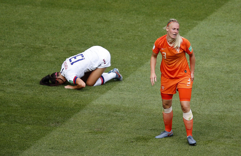 United States' Alex Morgan lies on the pitch after a foul by Netherlands' Stefanie Van Der Gragt during the Women's World Cup final soccer match between US and The Netherlands at the Stade de Lyon in Decines, outside Lyon, France, Sunday, July 7, 2019. (AP Photo/Francois Mori)