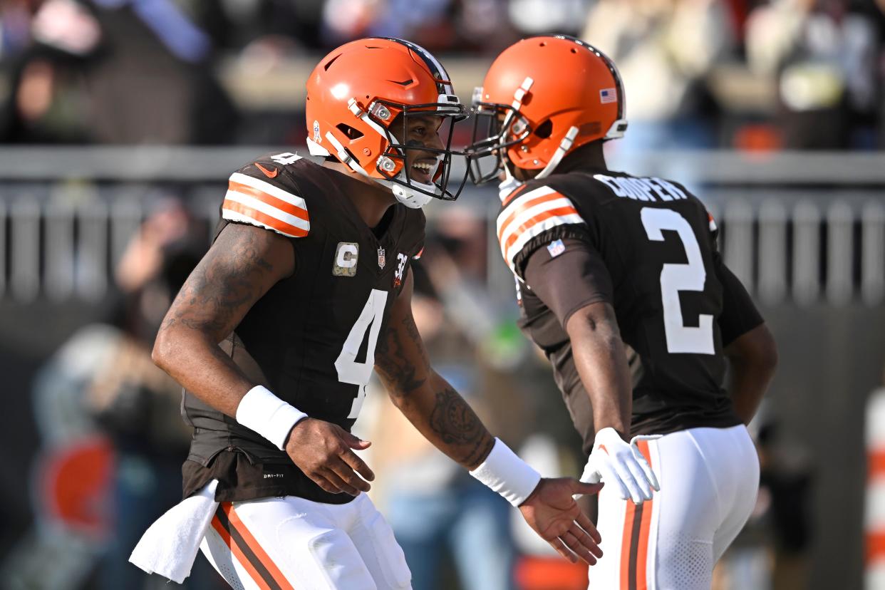 Cleveland Browns quarterback Deshaun Watson (4) is congratulated by wide receiver Amari Cooper (2) after throwing a touchdown pass to tight end David Njoku against the Arizona Cardinals on Sunday in Cleveland.