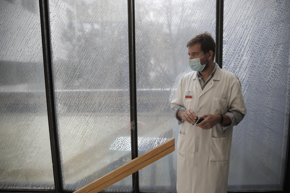 Head of the child psychiatry service, Richard Delorme, stands on a stairwell in the pediatric unit of the Robert Debre hospital, in Paris, France, Wednesday, March 3, 2021. At Robert Debre, the psychiatric unit typically used to see about 20 attempted suicide cases per month involving children aged 15 and under. Not only has that number now doubled in some months since September, but some children also seem ever-more determined to end their lives, Delorme said. (AP Photo/Christophe Ena)