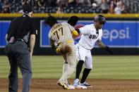 Arizona Diamondbacks' Ketel Marte, right, is safe at second base as San Diego Padres shortstop C.J. Abrams (77) is unable to catch the ball, while umpire Bill Welke watches during the ninth inning of a baseball game Tuesday, June 28, 2022, in Phoenix. The Diamondbacks won 7-6. (AP Photo/Ross D. Franklin)