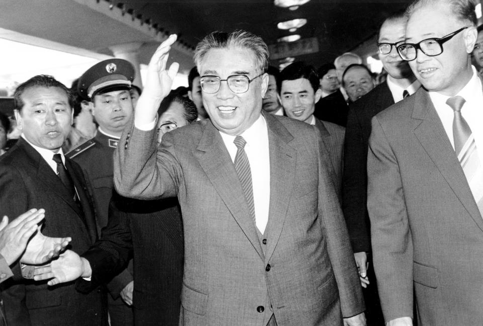 FILE - In this May 21, 1987, file photo, then North Korean President Kim Il Sung, center, and then Chinese Premier Zhao Ziyang make their way through a crowd of well-wishers at the train station in Beijing. North Korean leader Kim Jong Un’s two-week absence from public view has inspired speculation and rumors, but past disappearances of North Korea's ruling elite frequently have simply shown the disconnect between insatiable curiosity about the country and the secrecy surrounding its leadership.(AP Photo/Neal Ulevich, File)