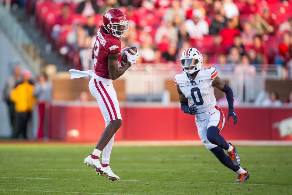 Nov 11, 2023; Fayetteville, Arkansas, USA; Arkansas Razorbacks wide receiver Andrew Armstrong (2) makes a catch as Auburn Tigers cornerback Keionte Scott (0) defends during the second quarter at Donald W. Reynolds Razorback Stadium. Mandatory Credit: Brett Rojo-USA TODAY Sports