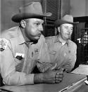 <p>Neshoba County Sheriff Lawrence Rainey, left, and his deputy Cecil Price, are back on the job in Philadelphia, Miss., after being released on a $5,000 bond, Dec. 5, 1964. Rainey and Price were charged by the government in connection with the slaying of three civil rights Freedom Summer workers last June. (Photo: Jack Thornell/AP) </p>
