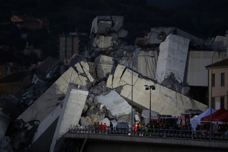 Rescuers worked through the rubble of the Morandi motorway bridge in Genoa overnight in the hope of finding more survivors