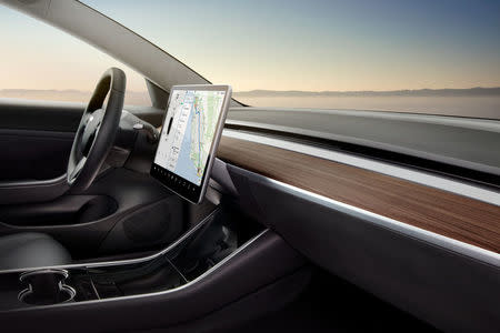 The interior of the Tesla Model 3 sedan is seen in this undated handout image as the car company handed over its first 30 Model 3 vehicles to employee buyers at the company’s Fremont facility in California, U.S. on July 28, 2017. Tesla/Handout via REUTERS